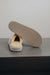 Alys Eco Sheepskin Slippers showing the bottom of the EVA sole on a Concrete Surface