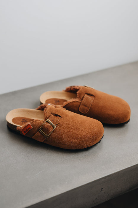 High angle of the baba rust clogs with dyed sheep skin and adjustable straps