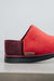 Close up View of Cadi Red Sheepskin Slippers with Heatons label detail on Concrete Surface