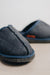 Close up of a pair of navy merino sheepskin men's mule slippers with a denim exterior.
