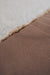 Close-up of a the rubber non
-slip underside of a sheepskin pet bed