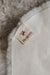 Close-up of a Heaton's label on a the suede back of a sheepskin rug