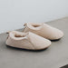 Side view of Grace - a vanilla coloured light soft-soled sheepskin slipper, that is handcrafted in Europe from the highest grade of premium Spanish merino sheepskin.