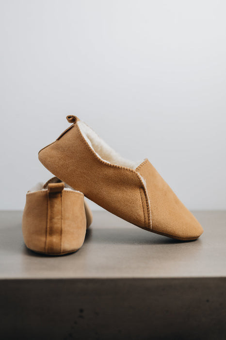Side and heel views of Grace - a light soft-soled sheepskin slipper, that is handcrafted in Europe from the highest grade of premium Spanish merino sheepskin.