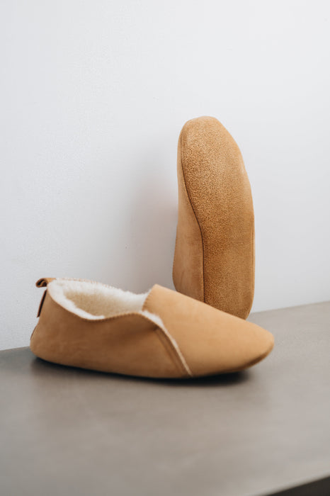 Bottom view of Grace, a light soft-soled sheepskin slipper, showing the soft suede sole of the bottom of the slipper.