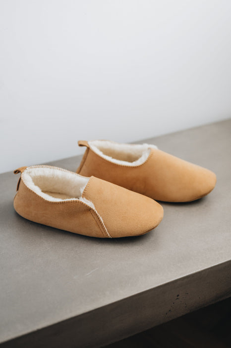 Side view of Grace - a light soft-soled sheepskin slipper, that is handcrafted in Europe from the highest grade of premium Spanish merino sheepskin.