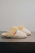 Side View of Gwen Eco Sheepskin Slippers on Concrete Surface