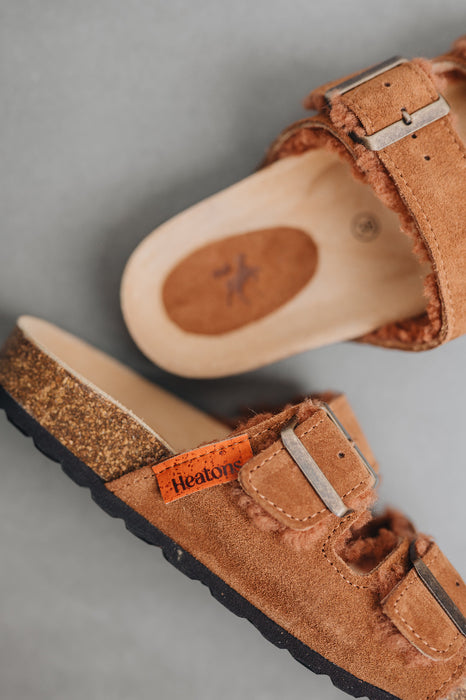 birds eye view of the metal buckle of the sandal