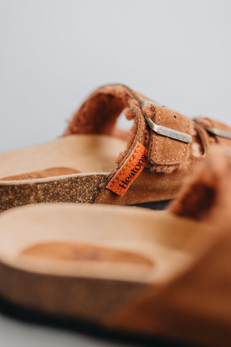 Close up on the heatons logo and strap and buckle