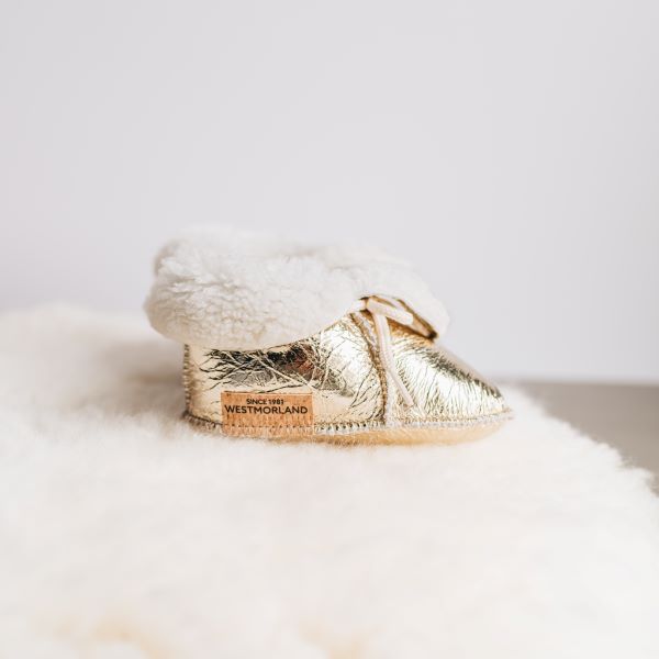 Westmorland Sheepskins Soft Soled Orange foil Baby Sheepskin Boots with a dyed Orange Sheepskin Cuff and laces.