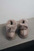 Front view of Ruby Walnut Sheepskin Slippers with Heatons label detail on Concrete Surface