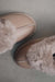 Close up View of Ruby Walnut Sheepskin Slippers on Concrete Surface