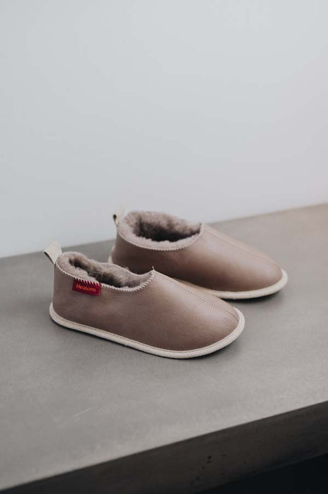 Side View of Sophia Walnut British Sheepskin Slippers on Concrete Surface