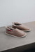 Side View of Sophia Walnut British Sheepskin Slippers on Concrete Surface