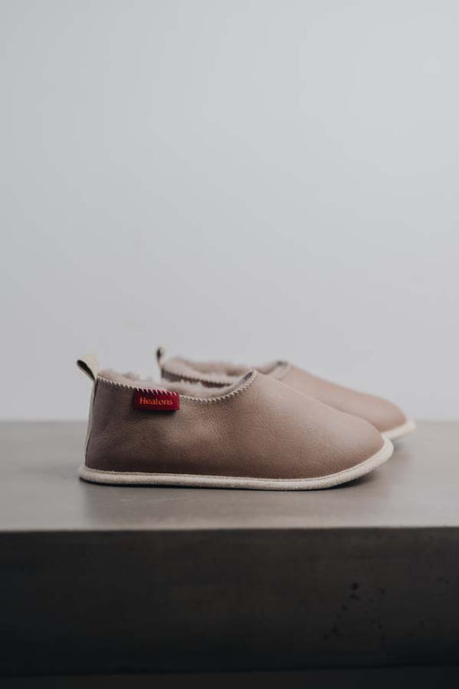 Side View of Sophia Walnut Sheepskin Slippers on Concrete Surface