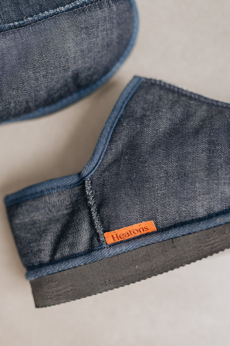 Mens Sheepskin Slipper with Denim Exterior for durability. Close up with Orange Cork Heatons label. 