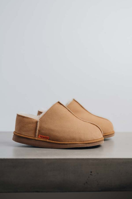 Side view of Cadi Tabac Sheepskin Slippers on Concrete Surface