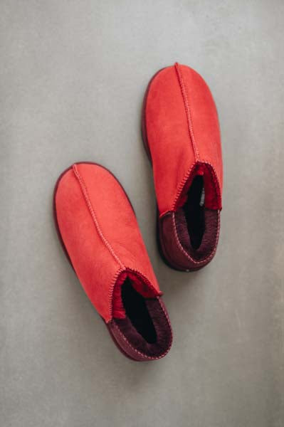 Birds Eye View of Cadi Red Sheepskin Slippers on Concrete Surface