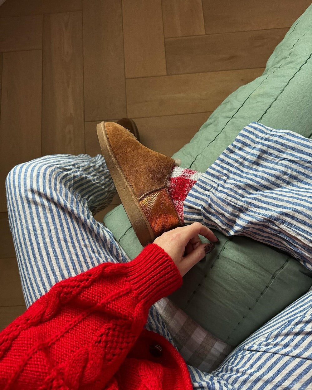 tan sheepskin slippers with decorative orange metallic back panel