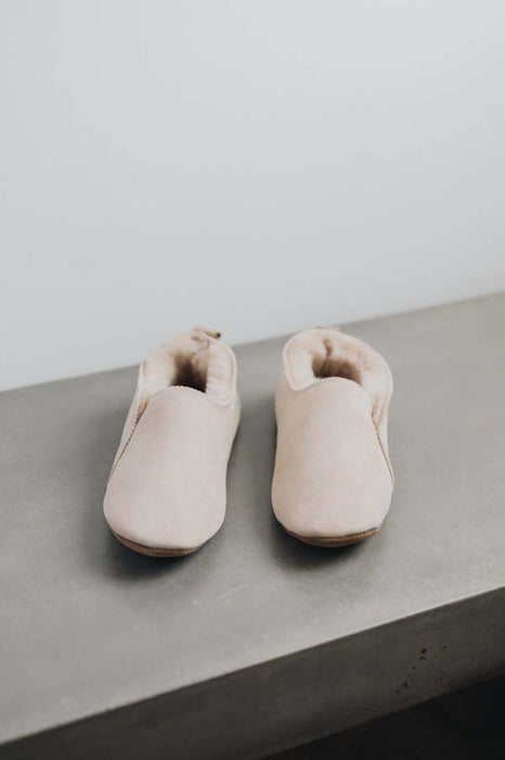 Front view of Grace, a light soft-soled sheepskin slipper in vanilla.