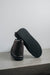 Noah dark brown Sheepskin Slippers showing the bottom of the EVA sole on a Concrete Surface