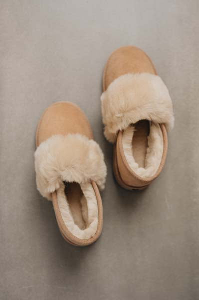 Birds eye view of Margot Tabac Sheepskin Slippers on Concrete Surface
