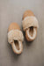 Birds eye view of Margot Tabac Sheepskin Slippers on Concrete Surface