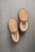 Birds eye view of Reggie men's Sheepskin Slippers on a Concrete Surface. 