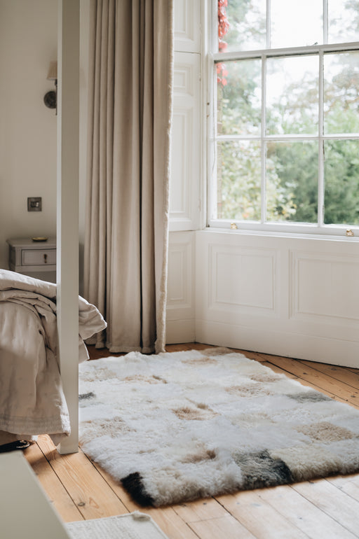 sheepskin rug with grey beige and white patchwork 