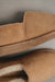 Close up  of Tan coloured loafer style sheepskin slipper 