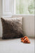 Veronica Slip on sheepskin mules on neutral carpet next to wheat colours floor cushion in window bay light.