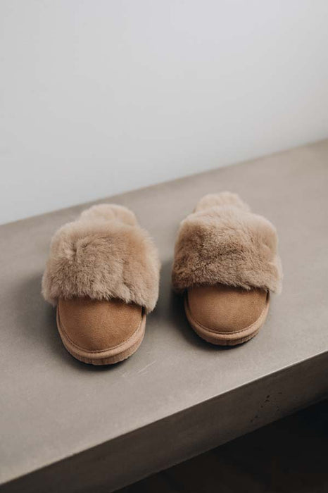 Front view of Veronica Taupe Sheepskin Slippers on Concrete Surface