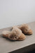 Side view of Veronica Taupe Sheepskin Slippers on Concrete Surface