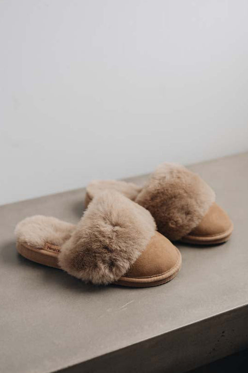 Side view of Veronica Taupe Sheepskin Slippers on Concrete Surface