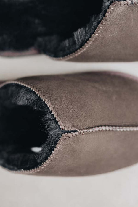 Close up of brown coloured slip on style sheepskin slipper 