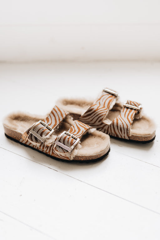 wommens sheepskin sandal with 2 buckle traps and a reflective zebra pattern finish