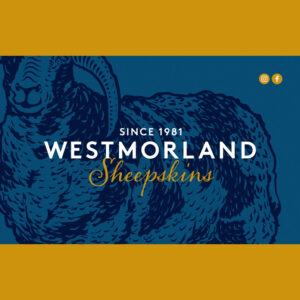 Gift Card. A blue rectangular shape with a large illustration of a horned woolen sheep. At the centre is written 'Westmorland Sheepskins'.