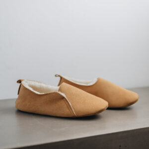 Side view of Grace - a light soft-soled sheepskin slipper, that is handcrafted in Europe from the highest grade of premium Spanish merino sheepskin.