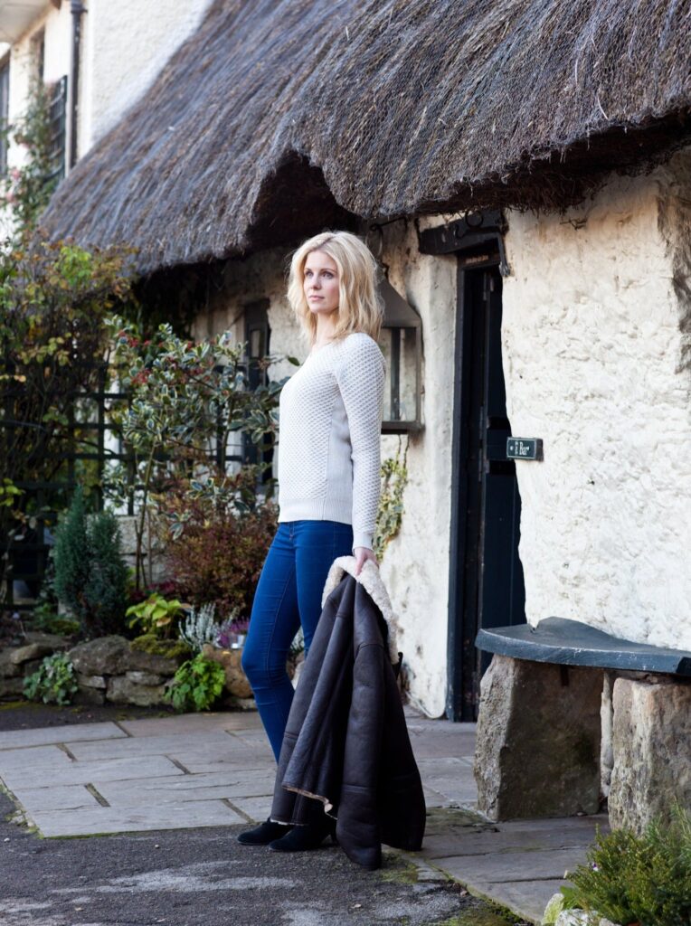 Brown leather and sheepskin hooded Women's Aviator Jacket, worn by a blonde model.