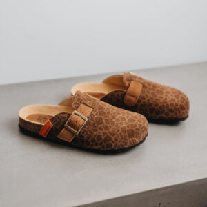 High angle of the lyra sahara clog, showing off its animal print and adjustable strap
