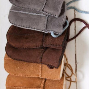 A row of baby / toddler Sheepskin Mittens in Tan, Brown and Grey. Features a string cord to stop losing them.