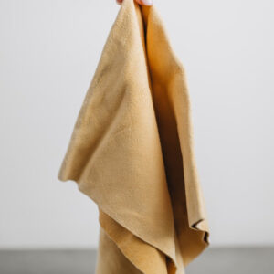 natural chamois leather cloth being held by model