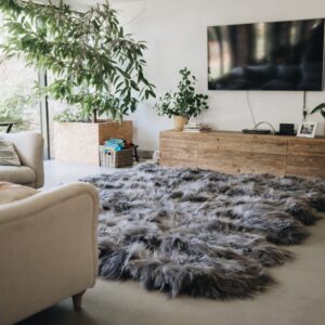 grey sheepskin rug in neutral living room on the floor