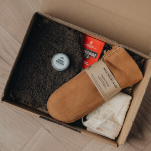 gift box with mittens, hot water bottle and hand cream
