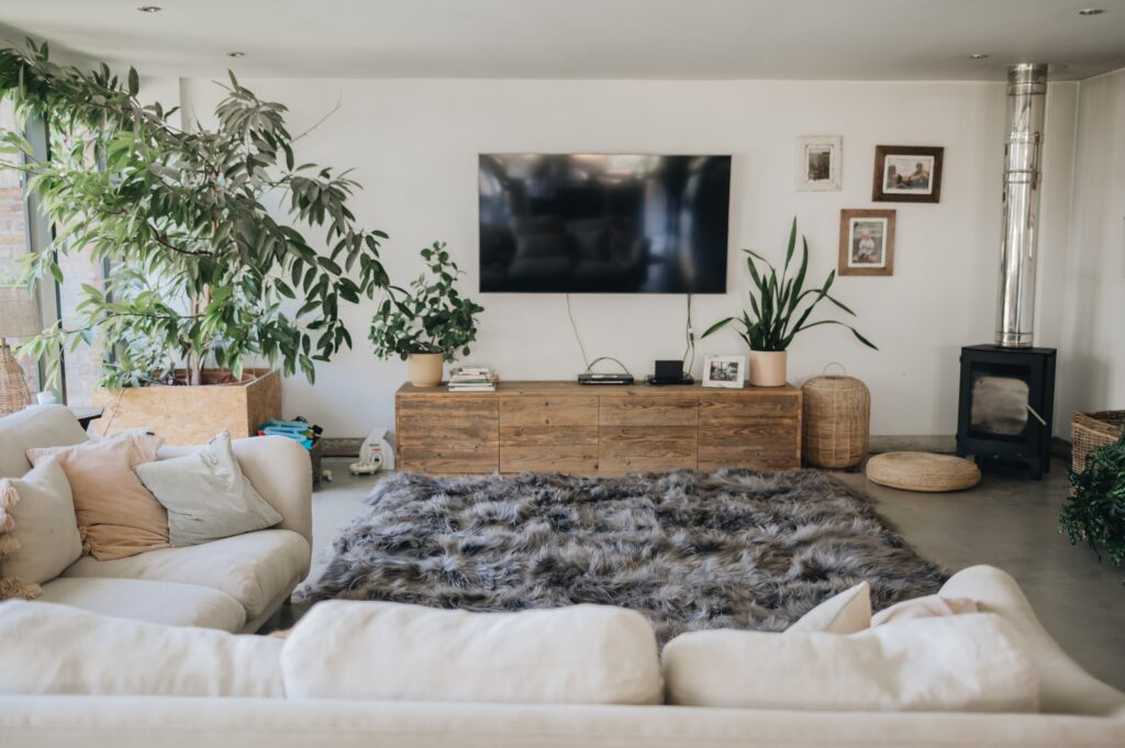 grey sheepskin rug on the floor of a living room