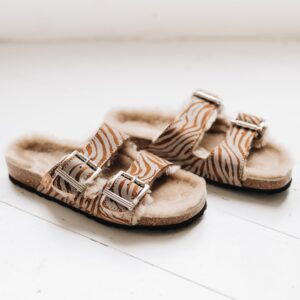 wommens sheepskin sandal with 2 buckle traps and a reflective zebra pattern finish